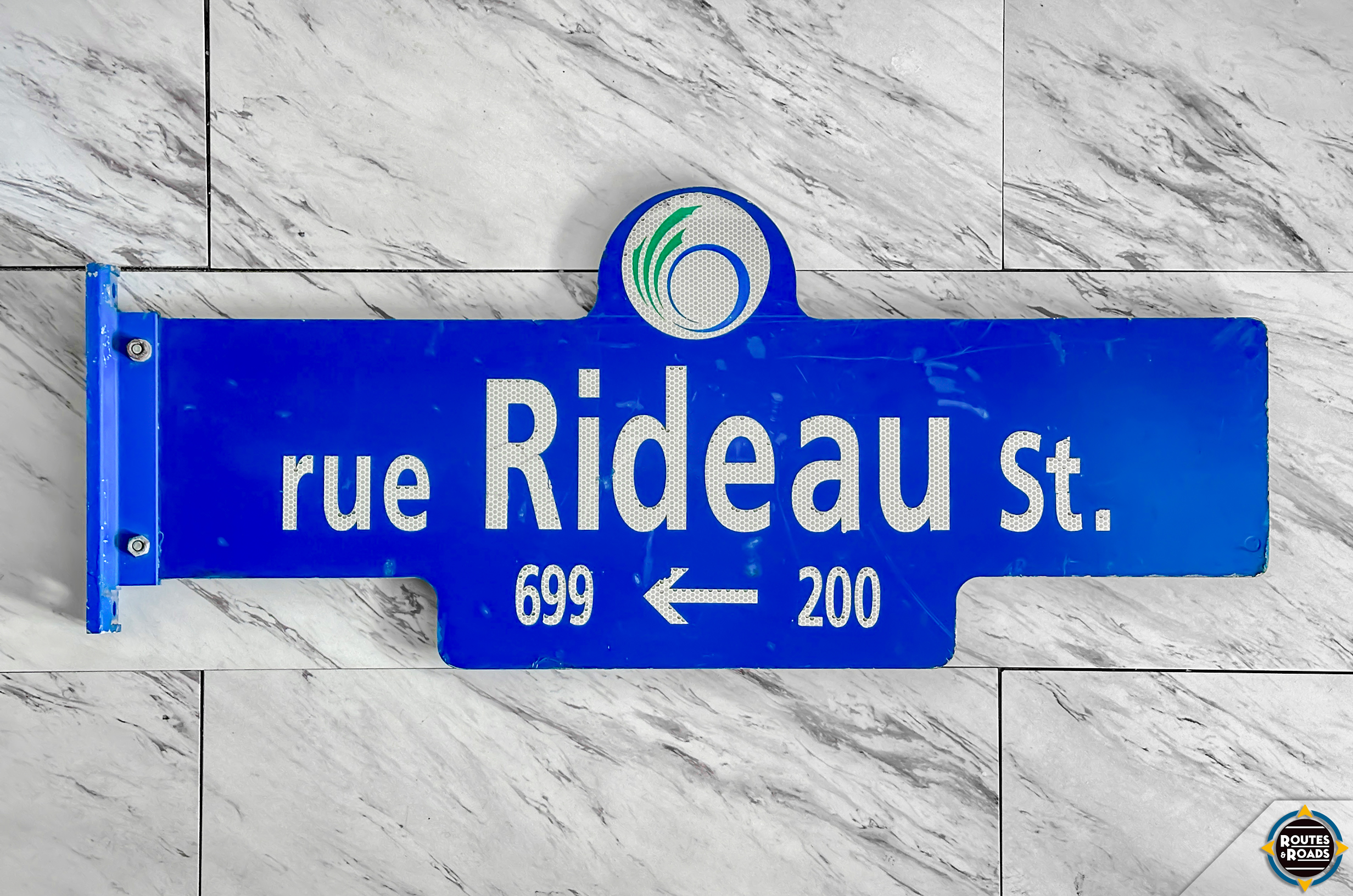 A heavy Rideau Street street sign from Ottawa, Ontario.